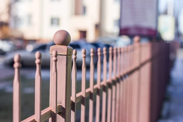 Metallic forged fence in the garden with balls and spikes. — Stock Photo, Image
