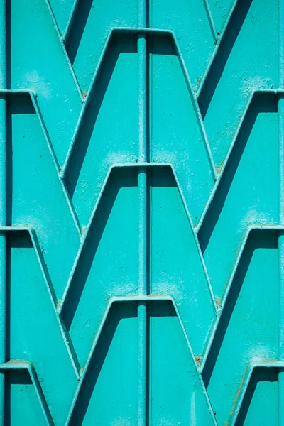 Decorative parts of metal gates. Metal turquois fence. Texture o — Stock Photo, Image