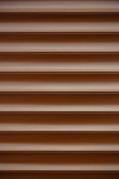 Metallic brown blinds. Abstract pattern lines waves Royalty Free Stock Images