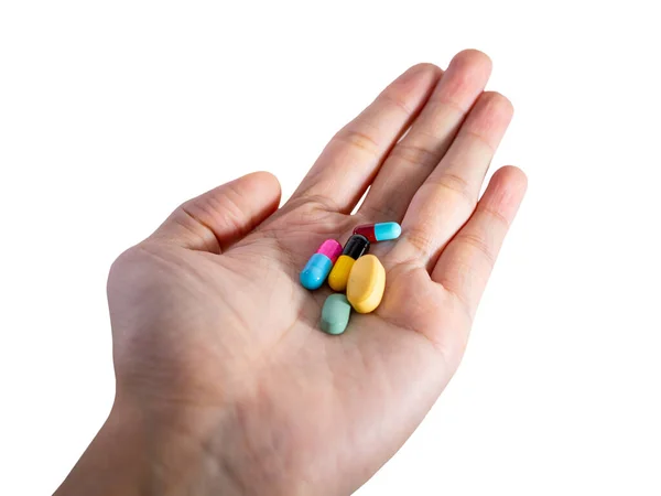 İnsanların elindeki ilaç beyaz arka planda izole edilmiş.