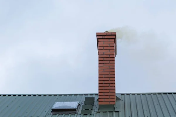 House chimney with flying smoke — Stock Photo, Image