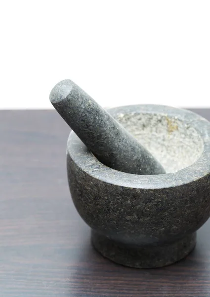 Mortaio di granito in piedi sul tavolo della cucina — Foto Stock