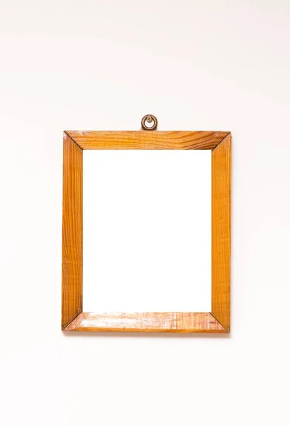 Wooden frame on white wall. — Stock Photo, Image