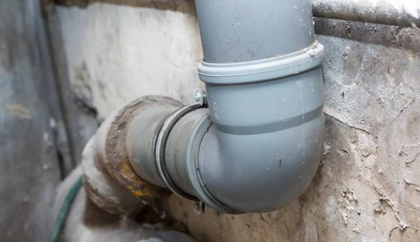 Sewer pipes in home basement — Stock Photo, Image