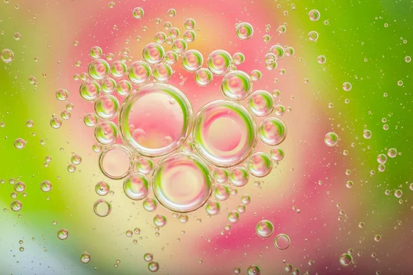 Oil droplets on water surface — Stock Photo, Image