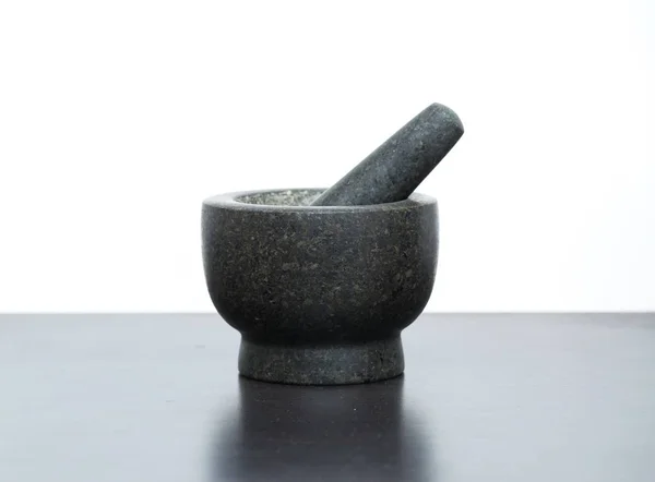 Granite mortar standing on kitchen table — Stock Photo, Image