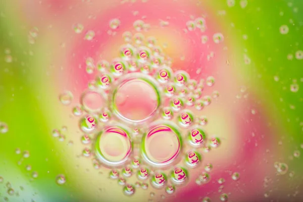 Oil droplets on water surface — Stock Photo, Image