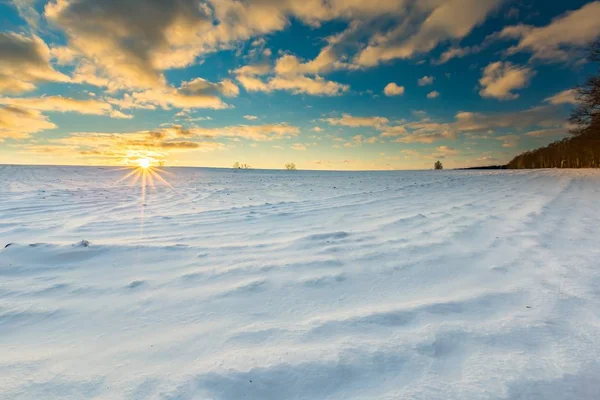 Beautiful winter sunset on fields