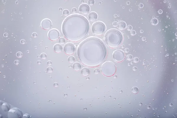 Gotas de óleo na superfície da água — Fotografia de Stock