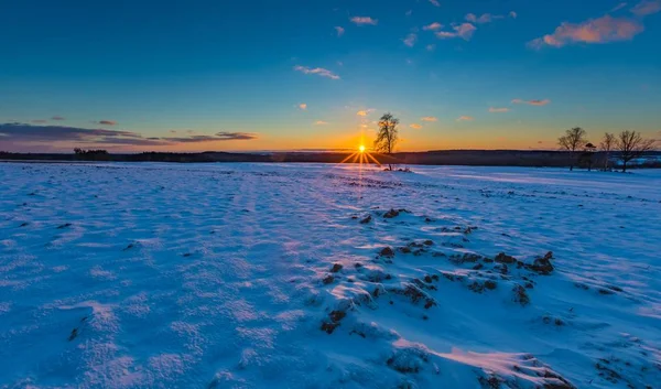 Beautiful winter sunset on fields