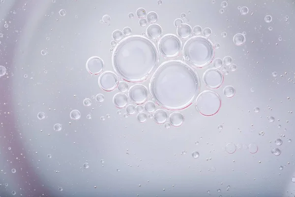 Oil droplets on water surface — Stock Photo, Image