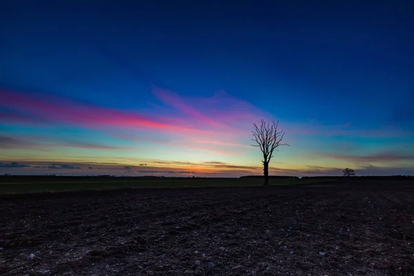 Beautiful vibrant sky over fields in Poland — Stock Photo, Image
