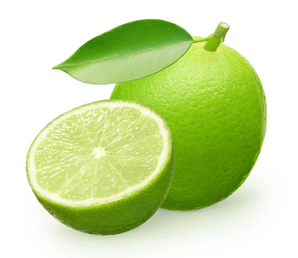 Ganze frische Limettenfrüchte mit grünem Blatt und der Hälfte — Stockfoto