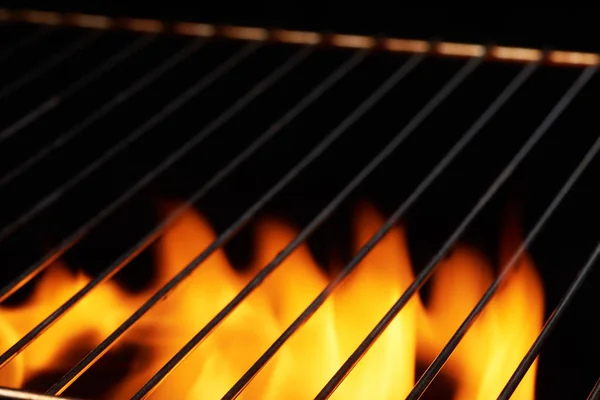 Empty clean black grill with flame. Culinary food background