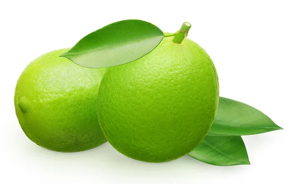 Whole fresh lime fruit next to lying and green leaves — Stock Photo, Image