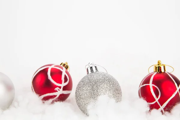Red and silver Christmas balls on abstract background