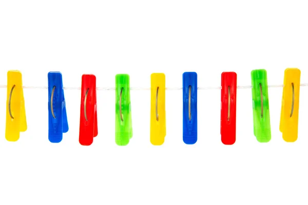 Some colored clothespins on a White background — Stock Photo, Image