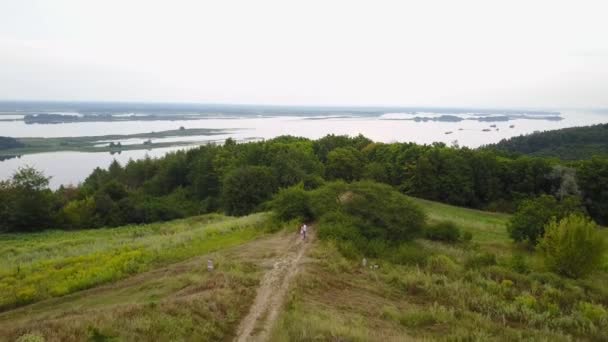 Aero Love story. Beautiful couple walks on the banks of the Dnieper River — Stock Video