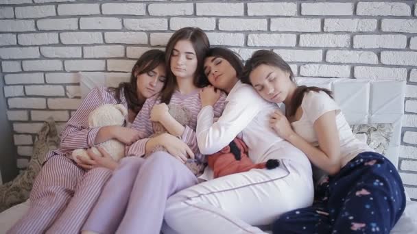 group of girls after celebrating hen night sleeping together on the