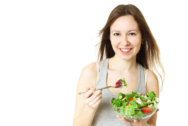 Happy young woman eating salad. — Stock Photo, Image