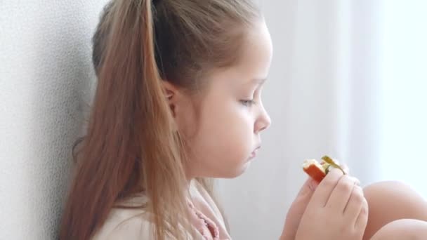 Close Up Girl eating sandwich in kitchen — Stock Video