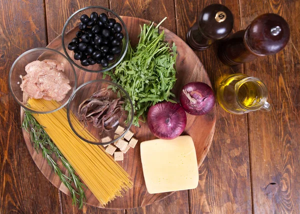 Pasta with anchovies and black olives — Stock Photo, Image