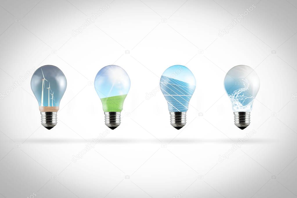 row of light bulbs with renewable energy symbols