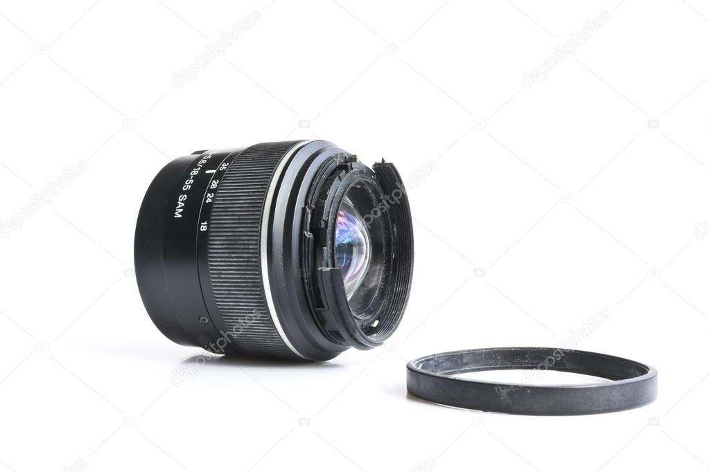 Broken SLR camera lens. Concept of careless attitude to photography.