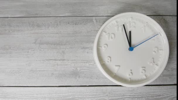 White clock on wooden surface. Moving second hand. The right composition — 비디오