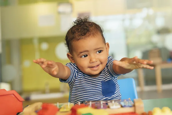Happy baby playing with toy blocks. — Stock Photo, Image