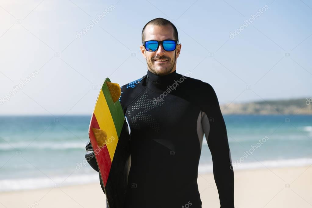 Portrait of handsome man kitesurfer.