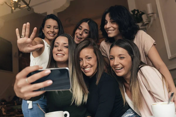 Friends taking a photo with a phone. — Stock Photo, Image