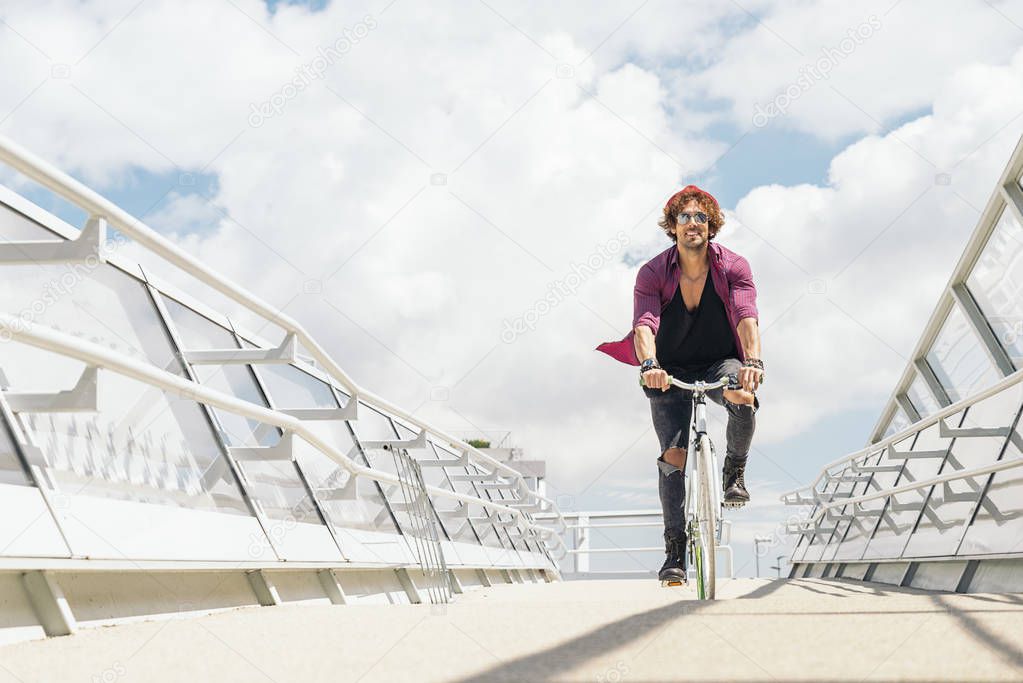 Handsome young man with fixed gear bicycle.