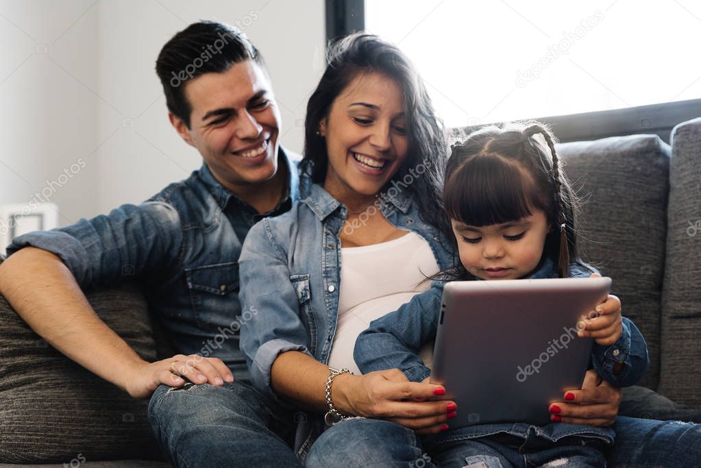 Happy family using tablet.