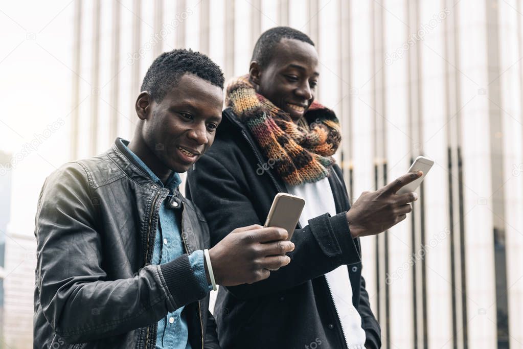 Business men using mobile in the Street.