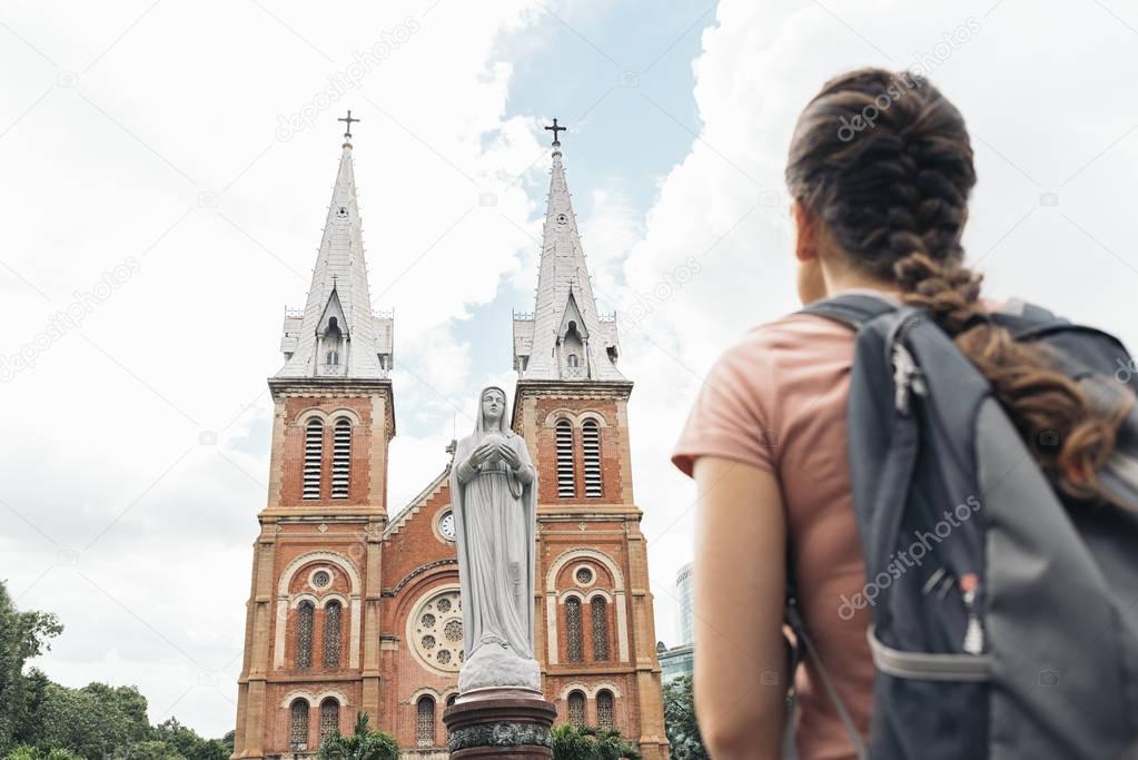 Tourist woman looking notre dame Church.