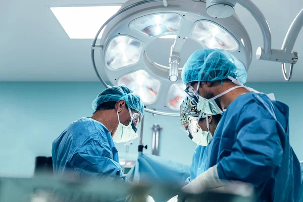 Team of Surgeons Operating. Stock Photo