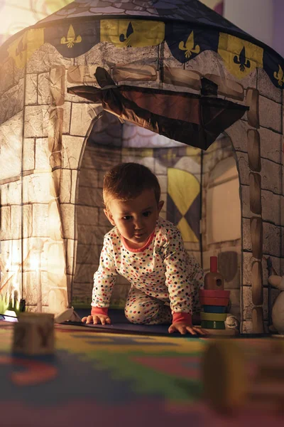 Little boy playing into castle toy at home. — Stock Photo, Image