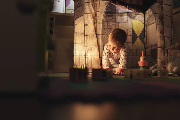 Little boy playing into castle toy at home. — Stock Photo, Image