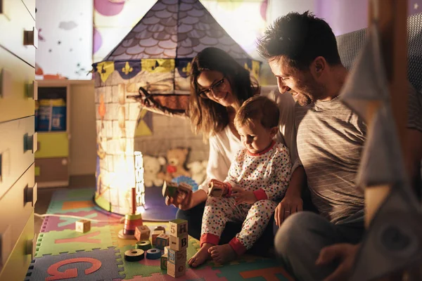 Parents enjoying playing with their son at home. — Stock Photo, Image