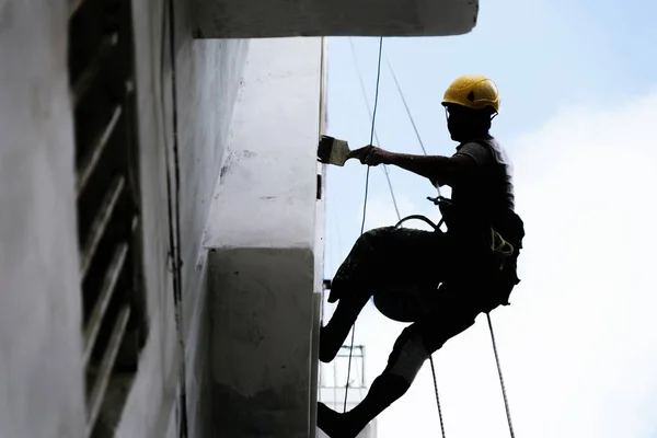 Painter working painting in the street. — Stock Photo, Image