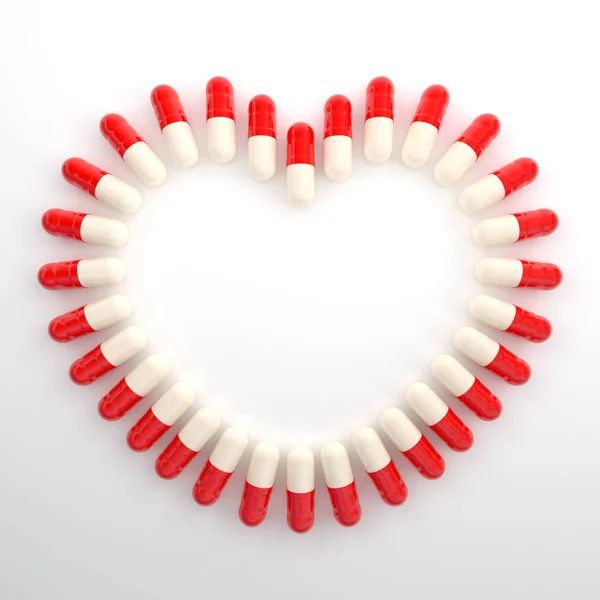 Pastillas de medicamentos cápsulas en forma de corazón — Foto de Stock