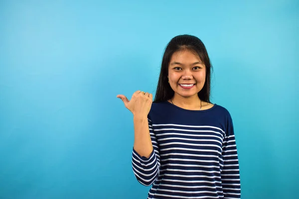 Portrait Young Beautiful Asian Women Blue Isolated Background Points Away — 스톡 사진