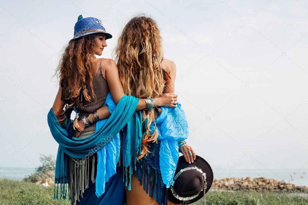Two beautiful gypsy girls in ethnic jewelry outdoors