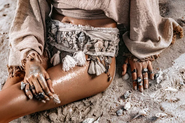 Close up of young tanned woman buttocks with boho accessories — Stock Photo, Image