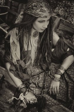 attractive gypsy style young woman in boat