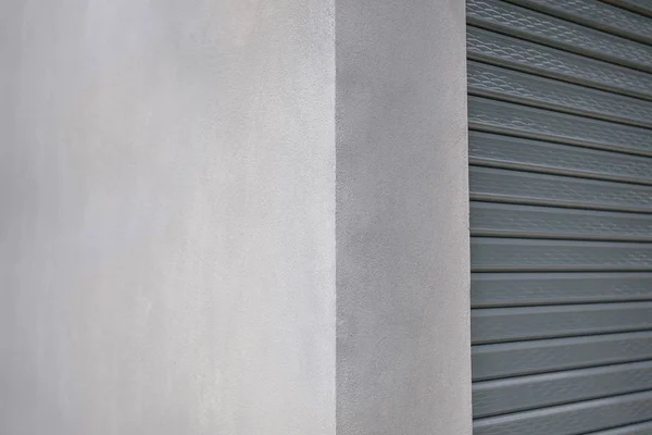 white wall of a house with garage door