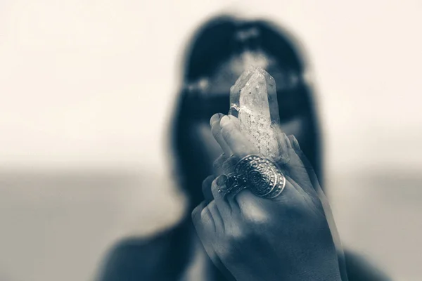 Close up of woman holding magic stone. black and white. — Stock Photo, Image