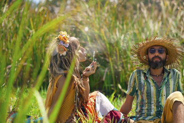 happy young man and woman posing together outdoors