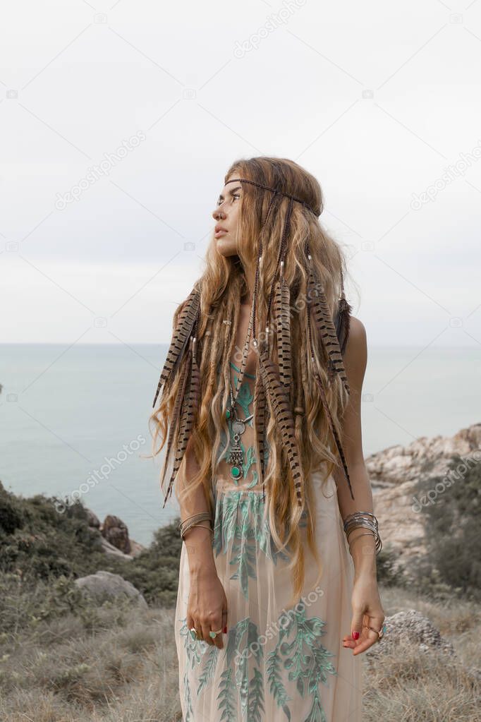 happy young caucasian woman in native clothes posing on tropical beach